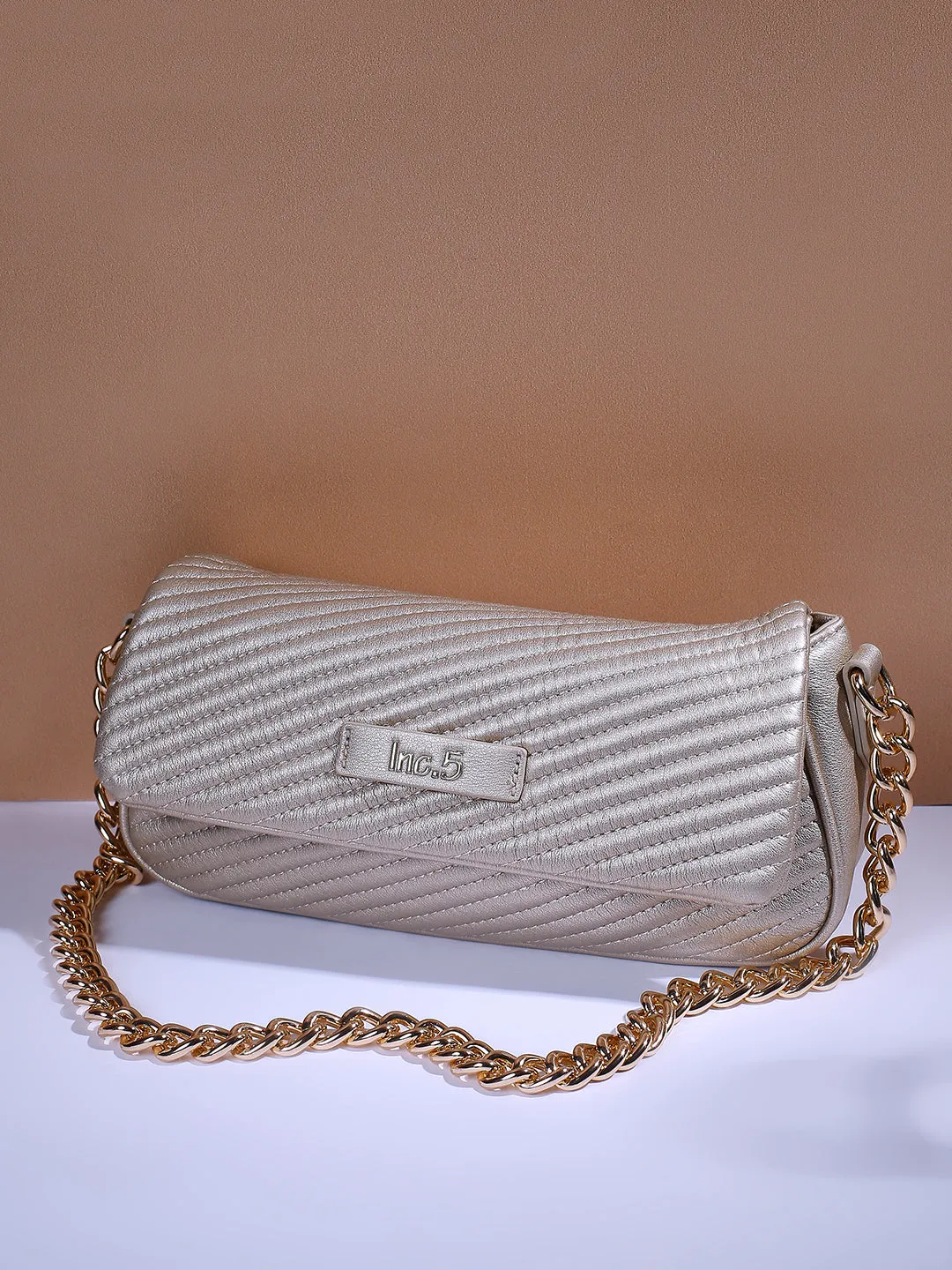 Womens Gold Textured Sling Bag